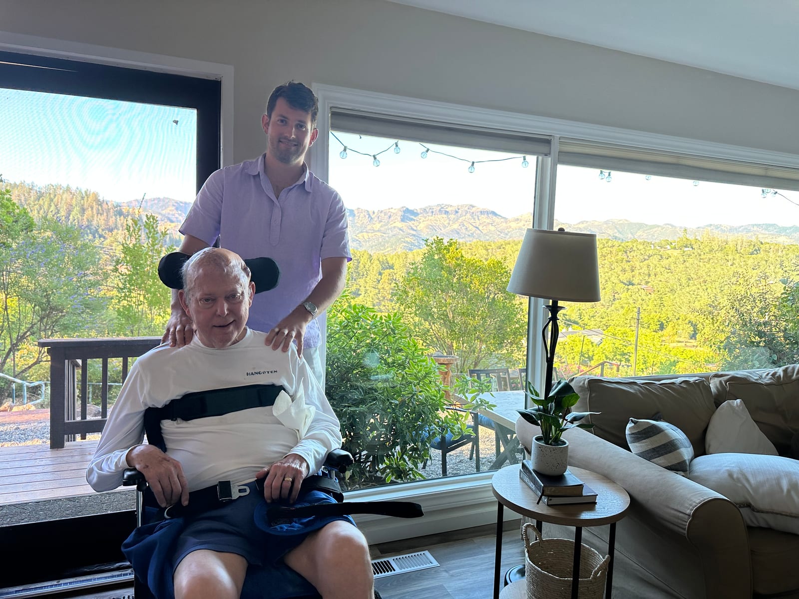 John with his dad by the window, the Santa Rosa hills beyond.