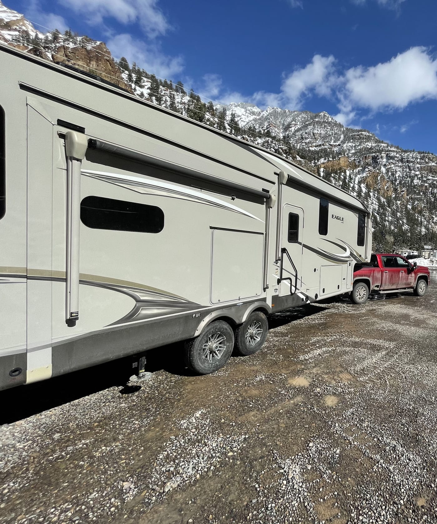 The truck and fifth-wheel parked below the Ouray peaks